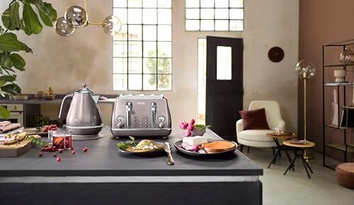 کتری استیل De'Longhi مدل 0210110165 Icona Metallics KBOT3001.PK، به ابعاد 275mm x 190mm x 240mm، رنگ صورتی/بنفش Image