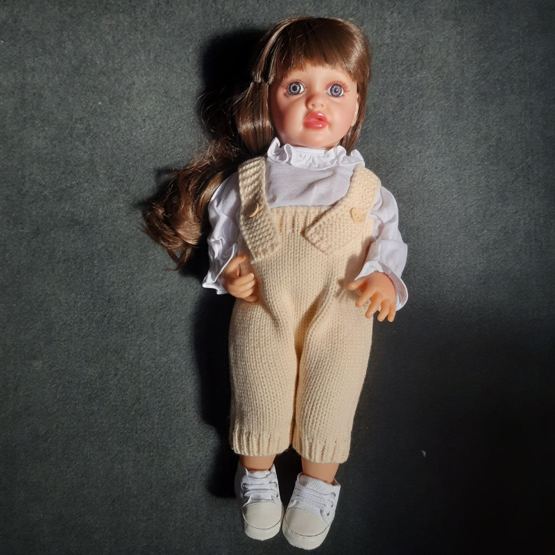 عروسک سیلیکونی وینیل واقعی ۲۲ اینچی(۵۵ سانتیمتر)با لباس کاموایی شیری رنگ و به همراه عروسک کوچک و لوازم جانبی برای سن +۳ reborn Image