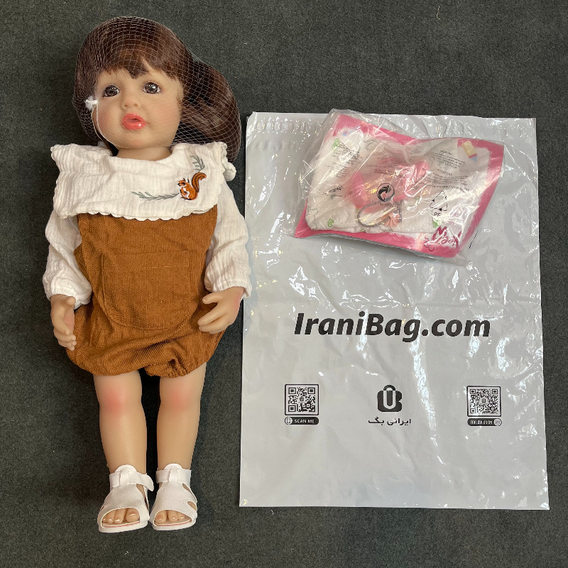 عروسک سیلیکونی وینیل واقعی ۲1 اینچی(۵3 سانتیمتر)با لباس قهوه ای رنگ کلاه دار و به همراه لوازم جانبی برای سن +۳ reborn Image